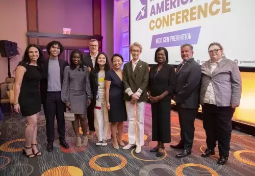 Young leaders from Mental Health America stand with CEO Schroeder Stribling